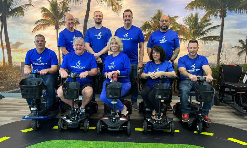 A staff photo of a Mobility City team members