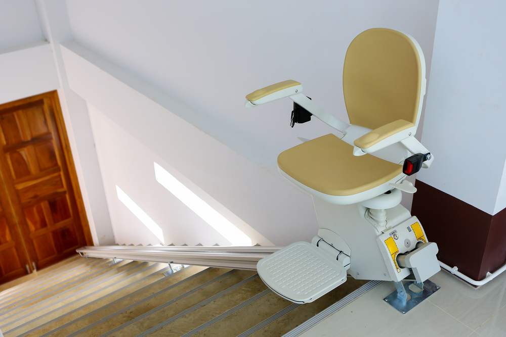 A stair lift on a straight staircase.