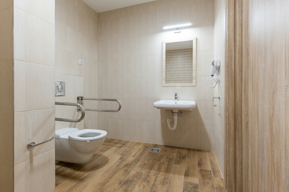 A bathroom featuring a variety of accessibility products.