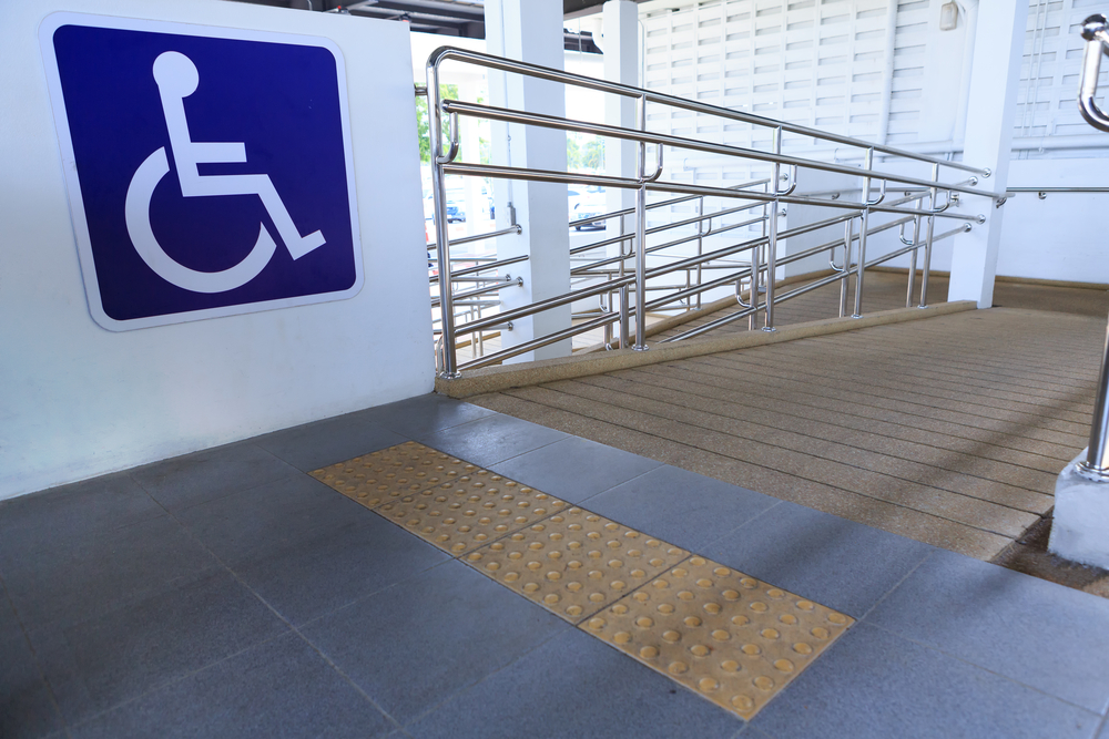 A permanent mobility ramp with a blue wheelchair symbol.